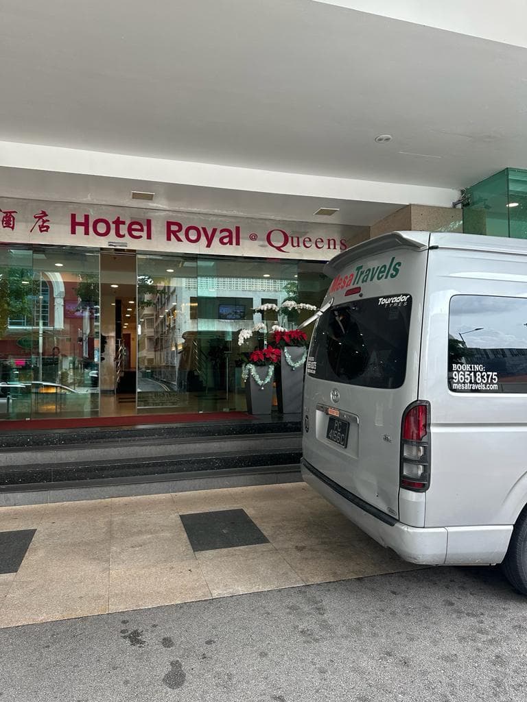 Mesa Travels vehicle parked outside Hotel Royal @ Queens for a Singapore hotel transfer