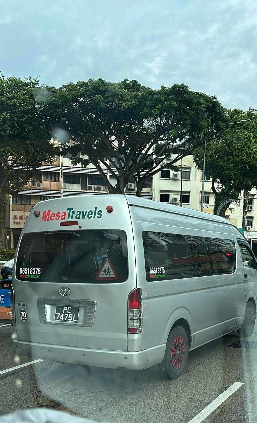 Mesa Travels maxi cab rear view with branding, Singapore night transfer