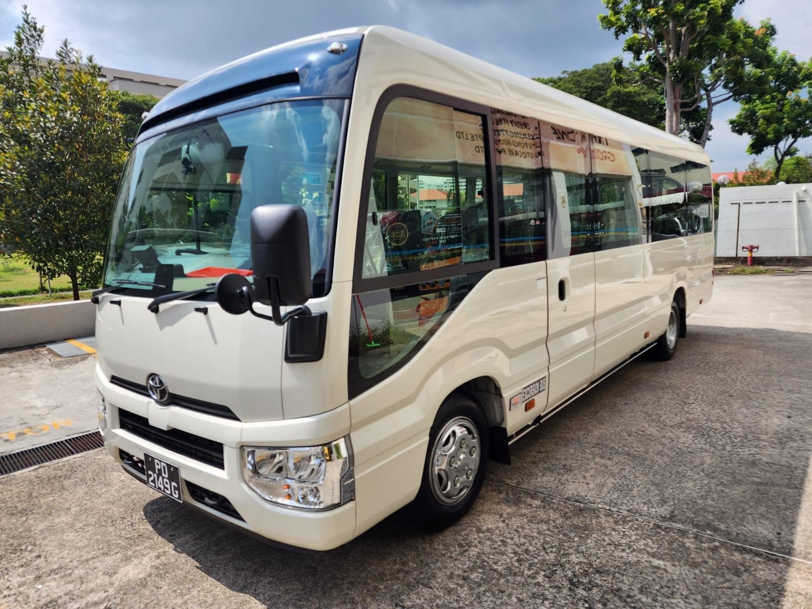 Mesa Travels 25-seater minibus for corporate airport transport in Singapore